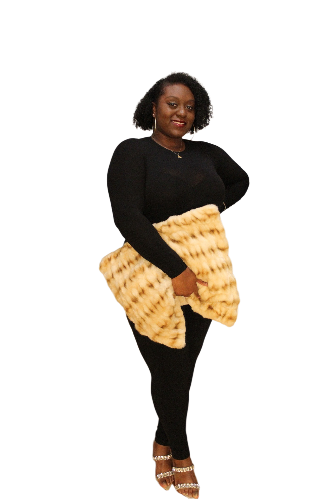 black model holding the tan oversized teddy bear clutch with one hand