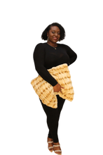 Load image into Gallery viewer, black model holding the tan oversized teddy bear clutch with one hand
